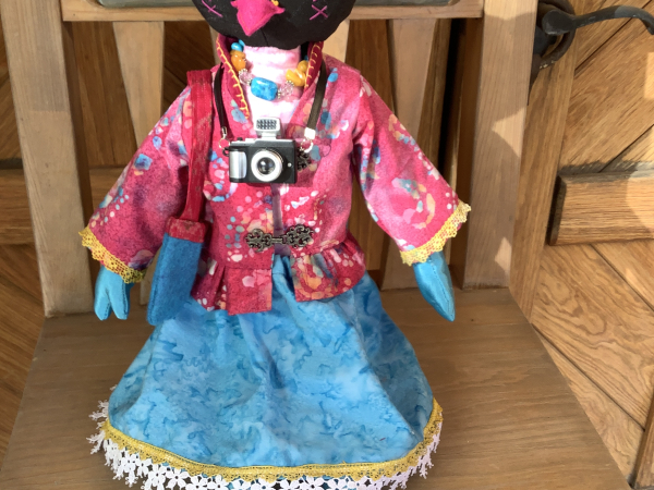 Ruby the Rainbow Owl Plays Tourist at the Rail Yard Market by KD Rivera